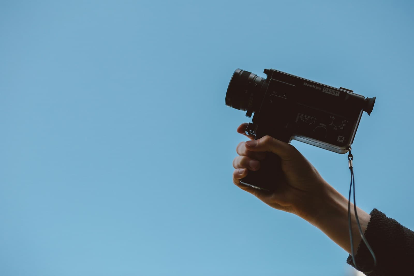 A person holding a video camera