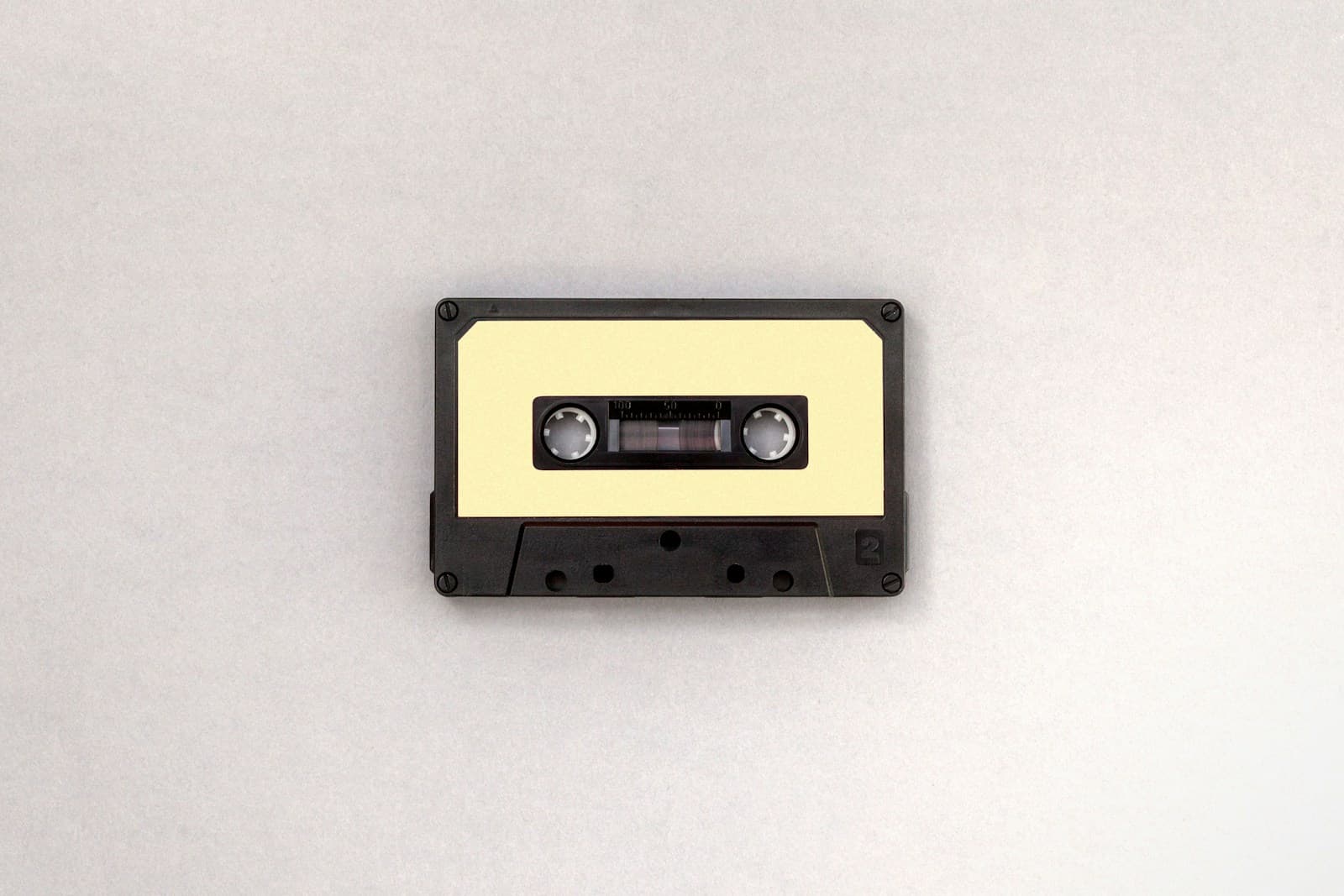A black and brown audio cassette tape