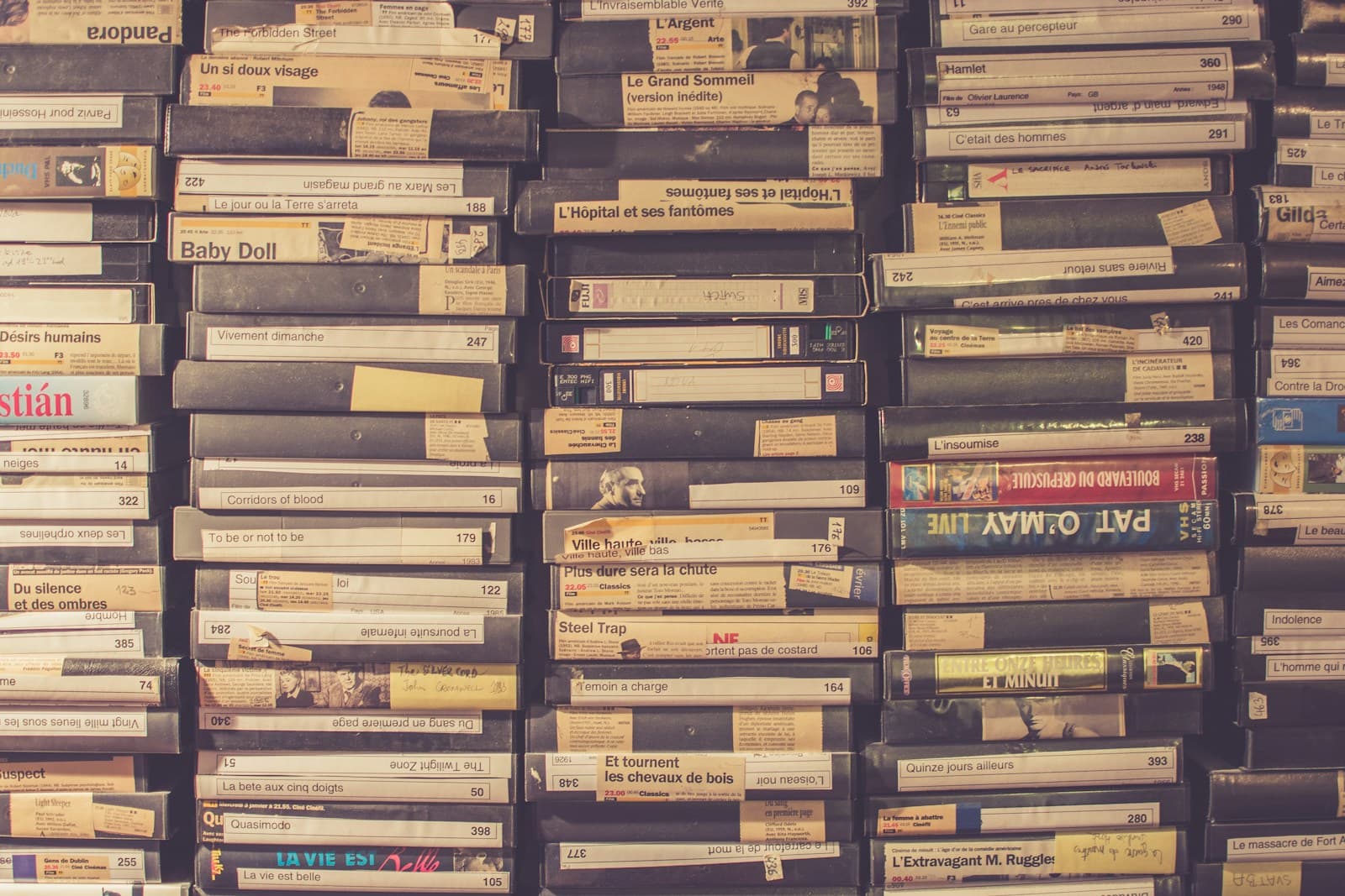 Shelves full of labelled home video tapes
